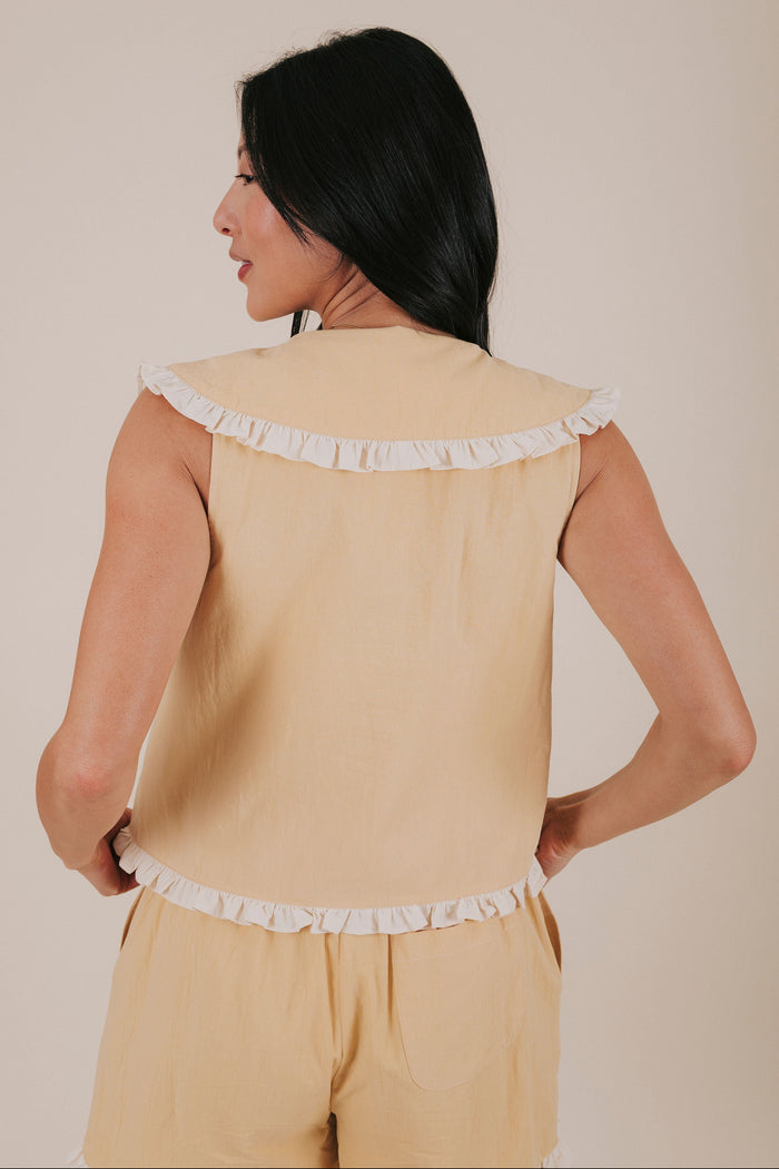 pale yellow ruffle tied ruffle top back