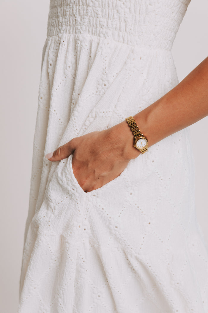sleeveless white eyelet maxi dress with shirred bodice pockets