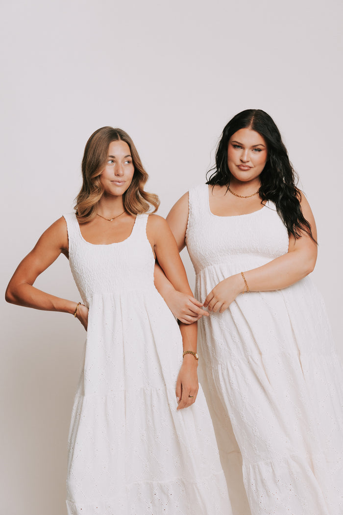 sleeveless white eyelet maxi dress with shirred bodice models full