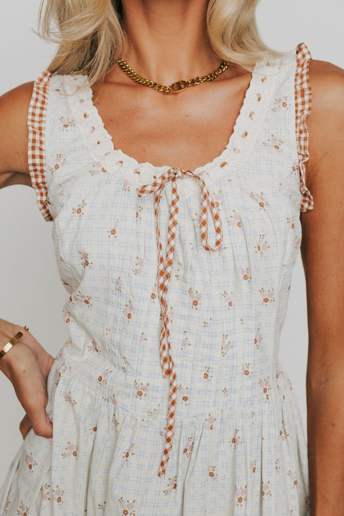 plaid floral midi dress with ruffled gingham trim close