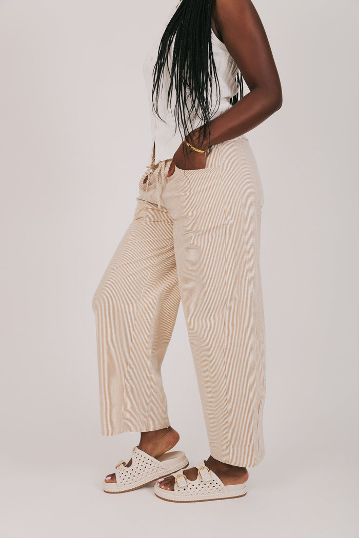 tan and white striped pants with ruffled waist side