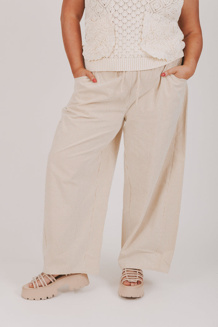 tan and white striped pants with ruffled waist plus front