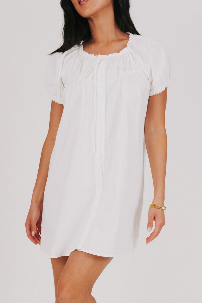 white mini dress with puff sleeves