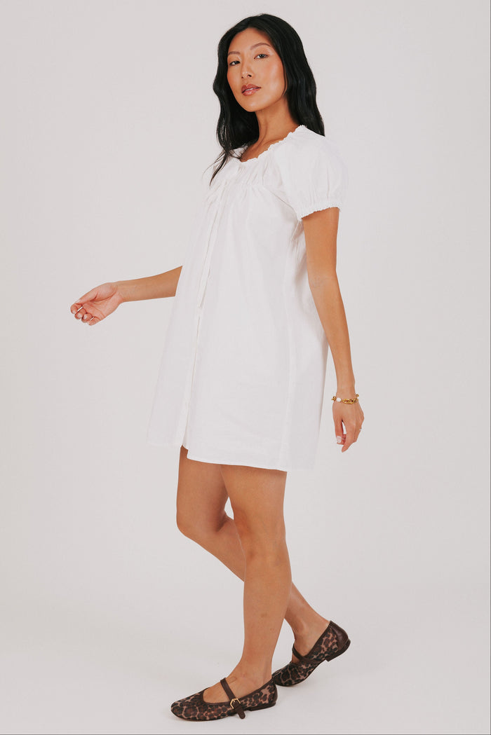 white mini dress with puff sleeves side