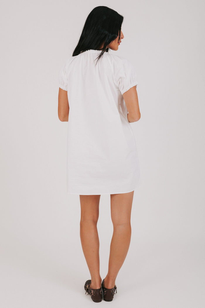 white mini dress with puff sleeves back