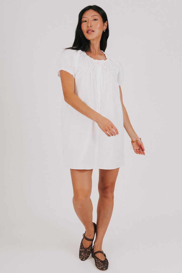 white mini dress with puff sleeves full
