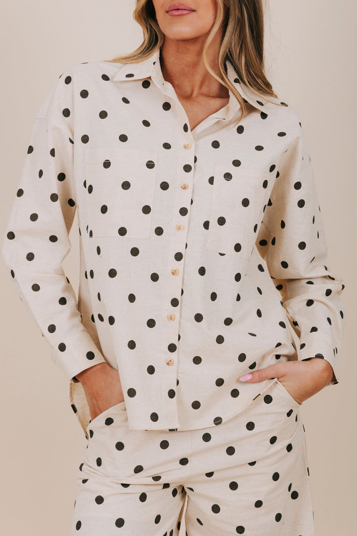black polka dot button down top detail