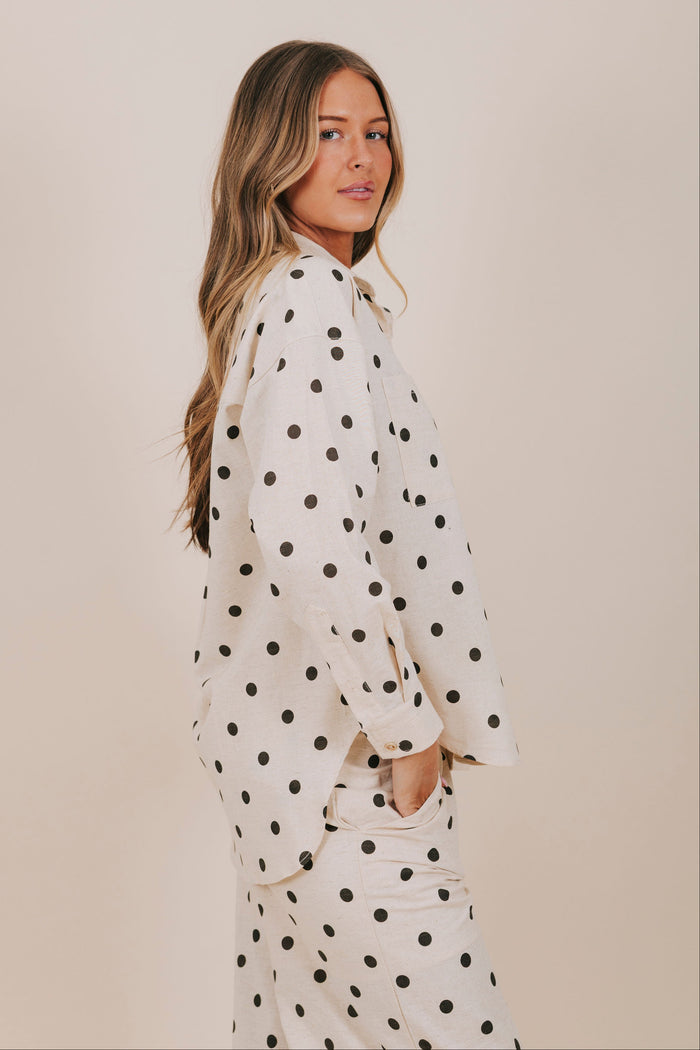 black polka dot button down top side