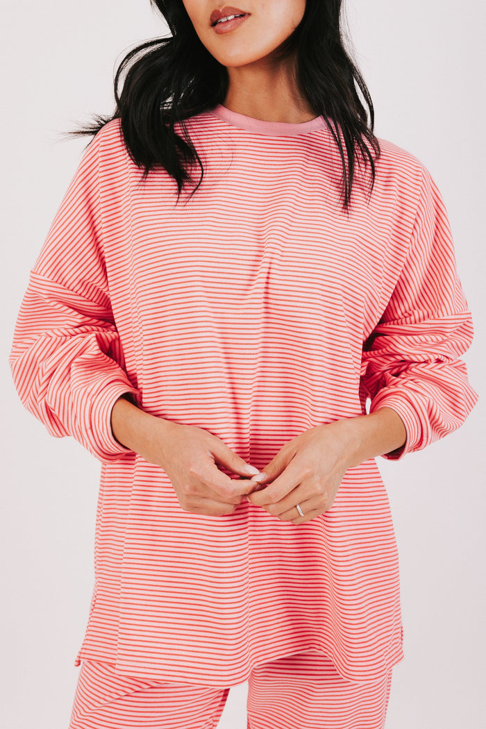pink and red striped oversized long sleeve top