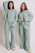 green striped lounge pants with button detail models