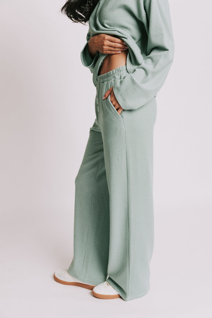 green striped lounge pants with button detail side