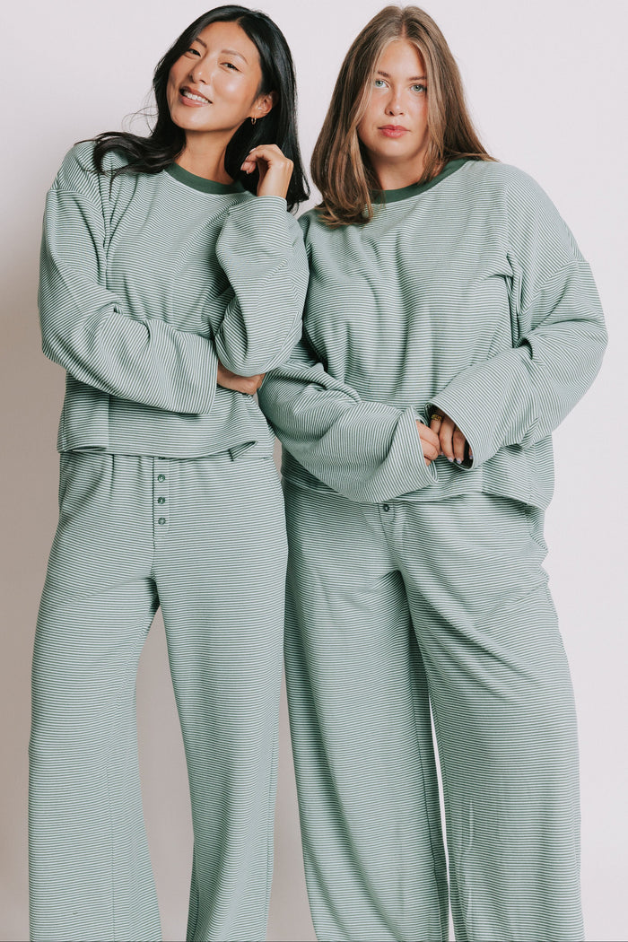 green striped long sleeve top with contrasting neckline models