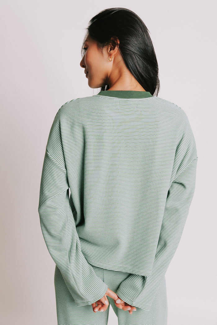 green striped long sleeve top with contrasting neckline back