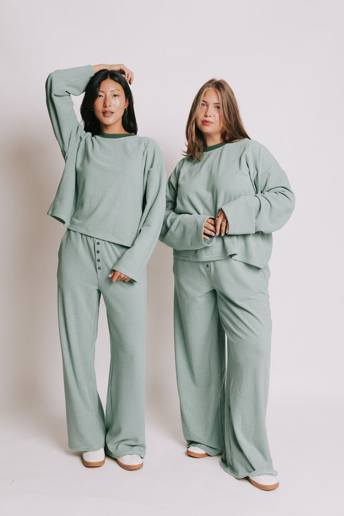 green striped long sleeve top with contrasting neckline models full