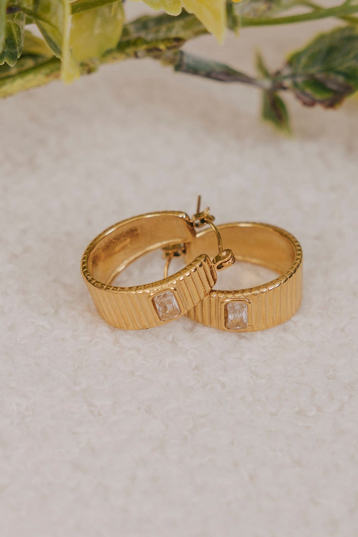 gold hoop earrings with texture and cubic zirconia