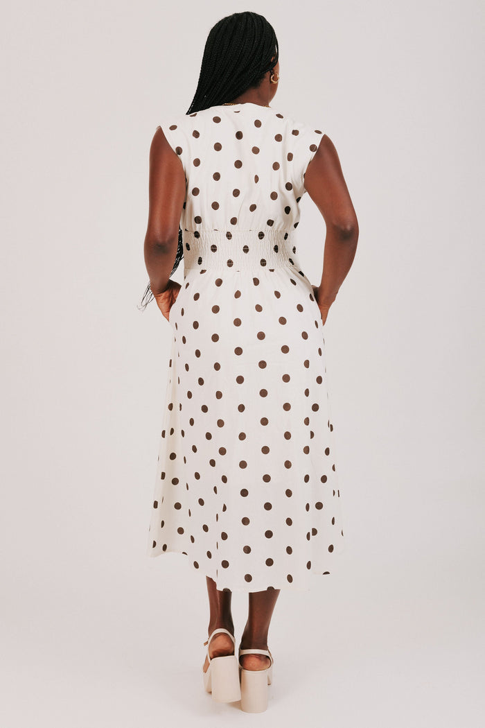 cream and brown polka dot dress with front zipper back