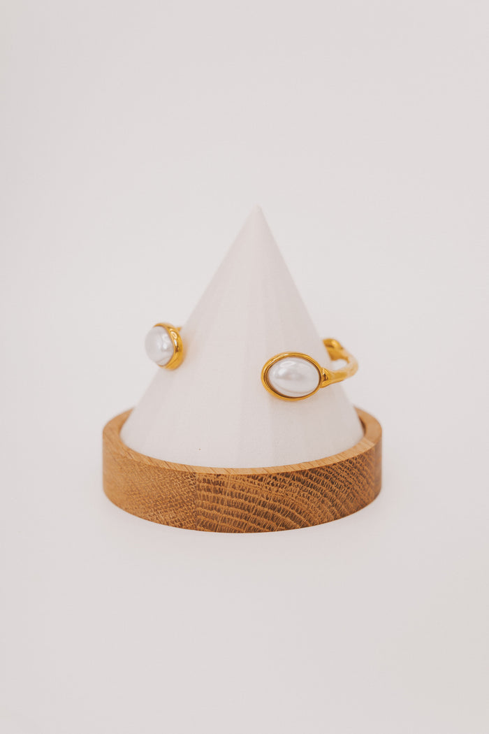 textured gold bracelet with pearl accents