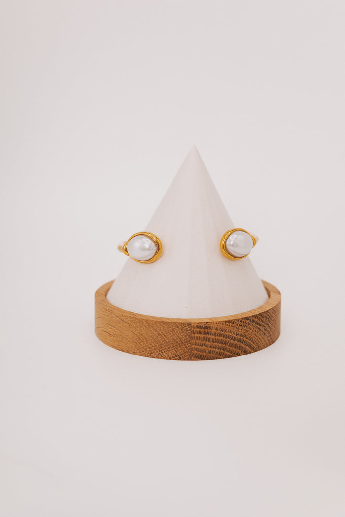 textured gold bracelet with pearl accents
