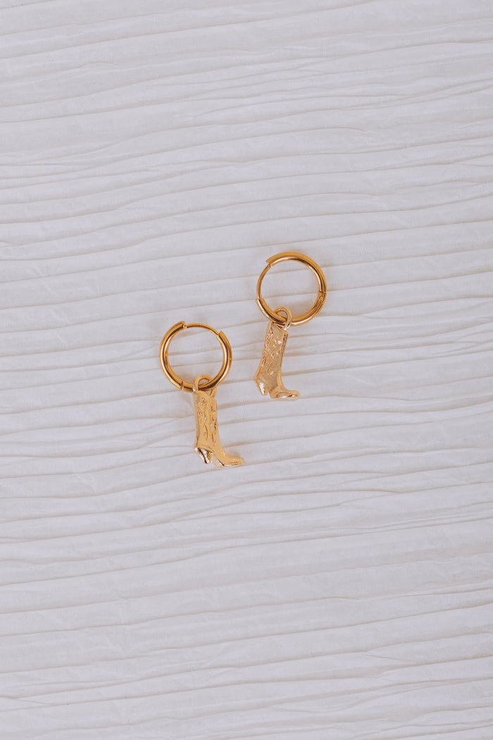 gold hoop huggie earrings with cowboy boot dangle