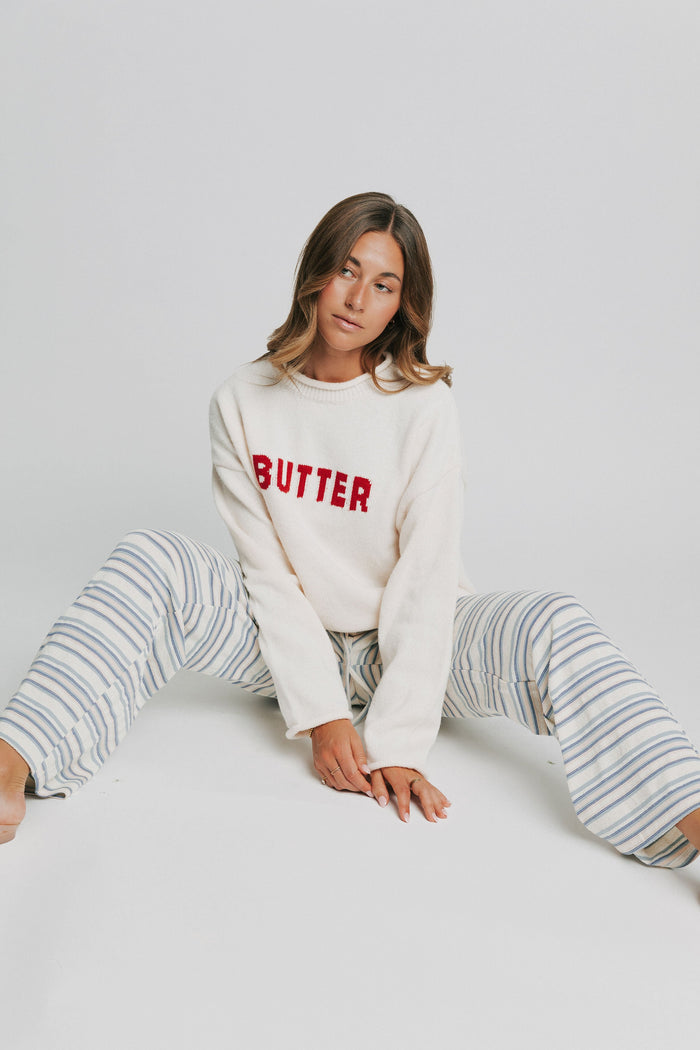 cream and blue striped lounge pants pose