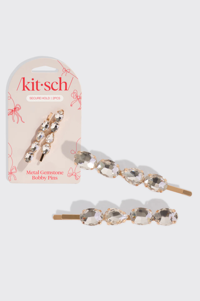 Metal gemstone bobby pins with packaging on a white background