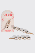 Metal gemstone bobby pins with packaging on a white background