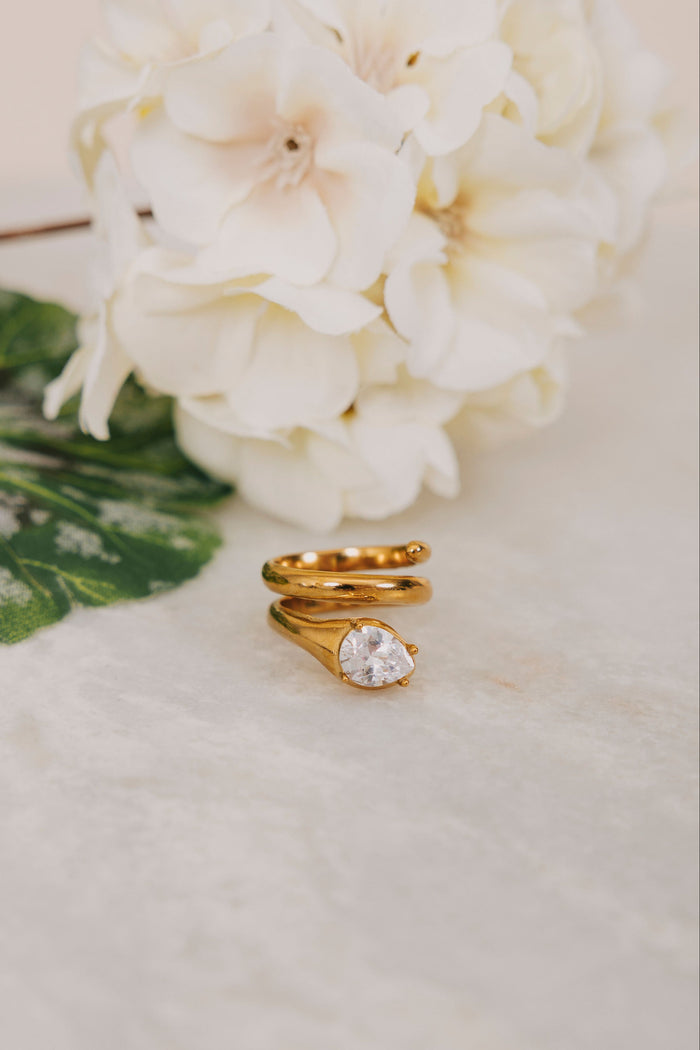Gold spiral ring with diamond detail