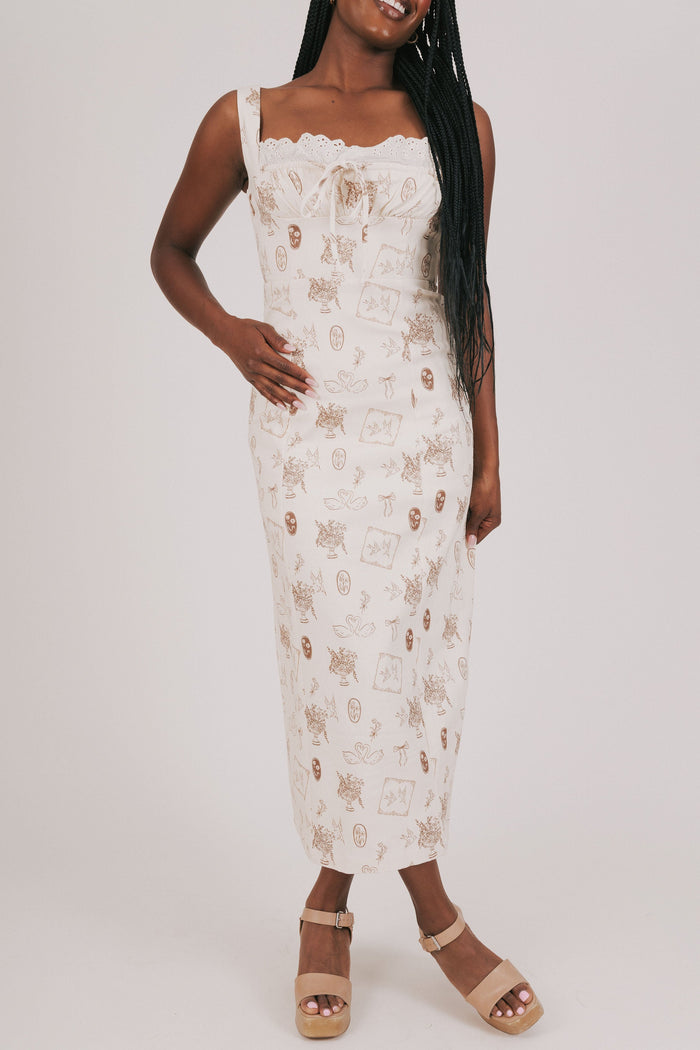 cream dress with brown print and lace detailing front