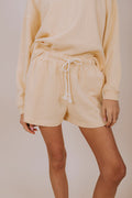 yellow drawstring shorts close up