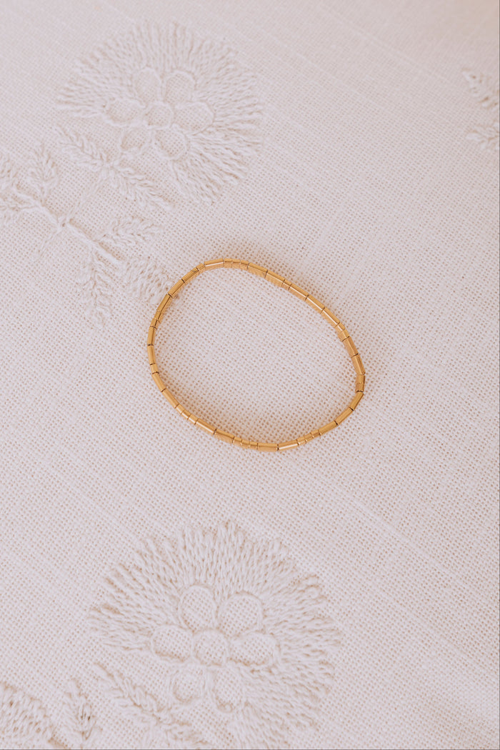 gold rectangle elastic bracelet flatlay