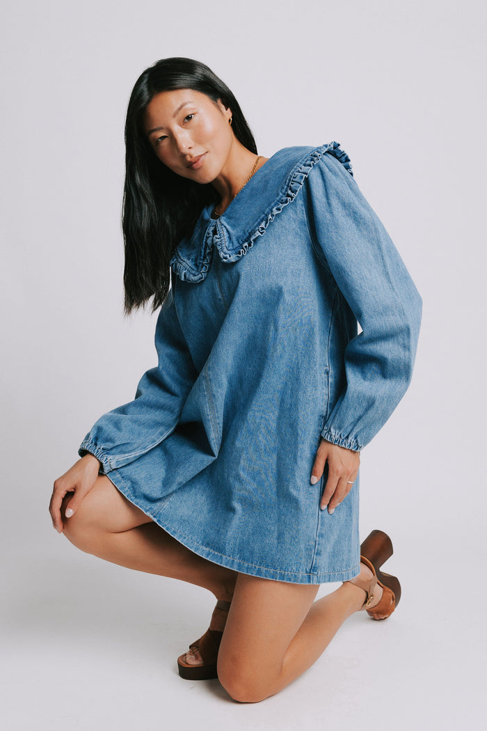 long sleeve denim mini dress with ruffled collar pose
