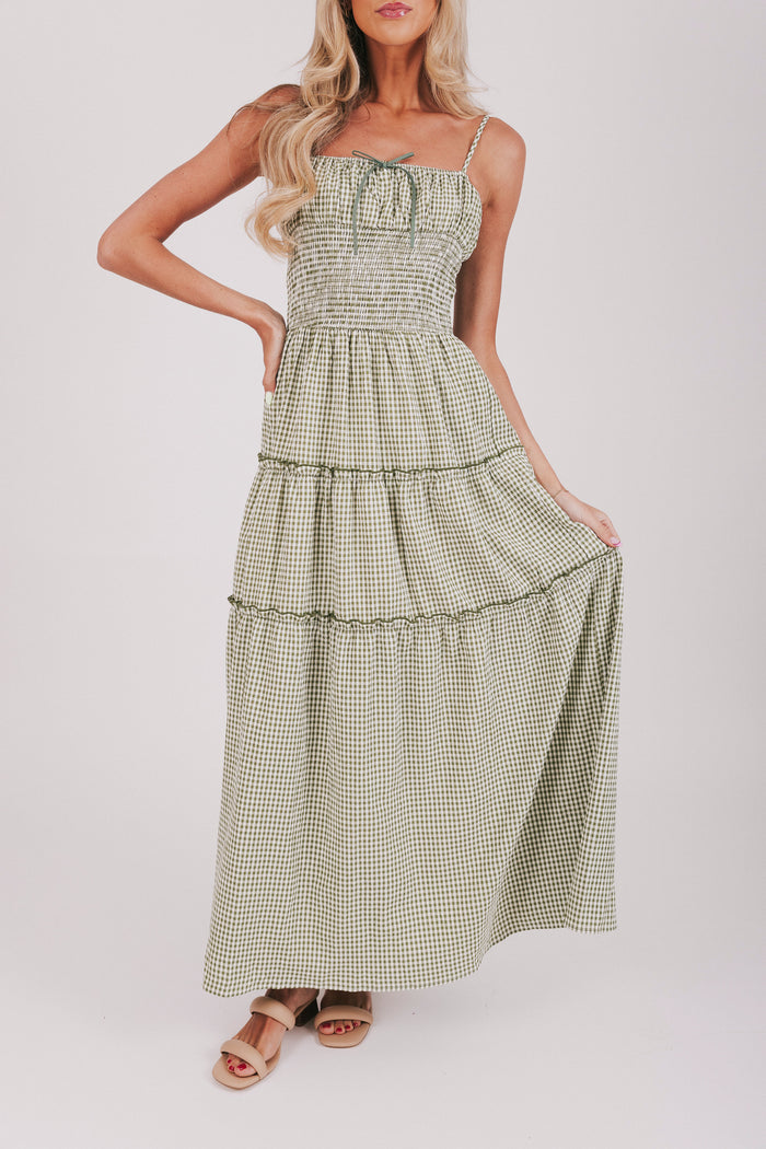 Olive and off white gingham maxi length dress with tied bow and shirred waist