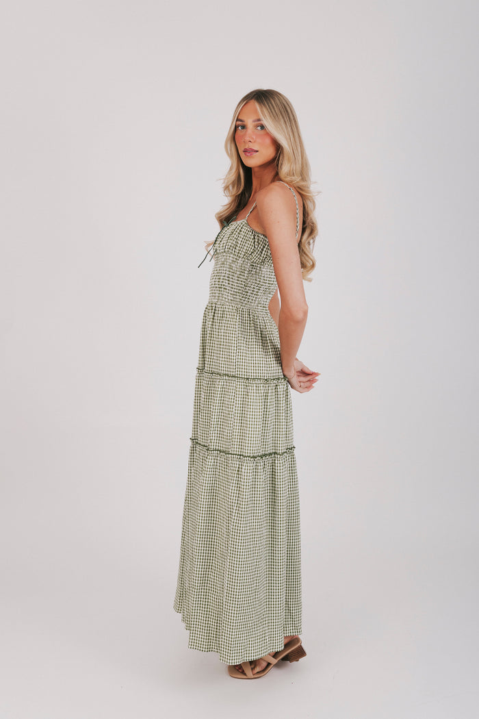 Olive and off white gingham maxi length dress with tied bow and shirred waist