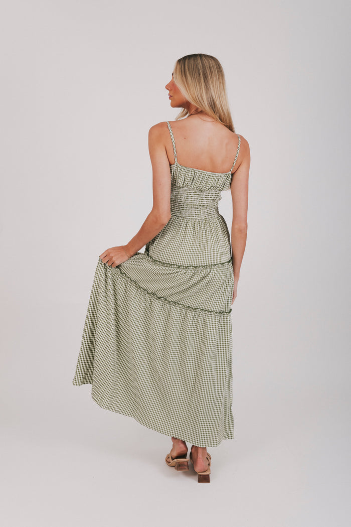 Olive and off white gingham maxi length dress with tied bow and shirred waist