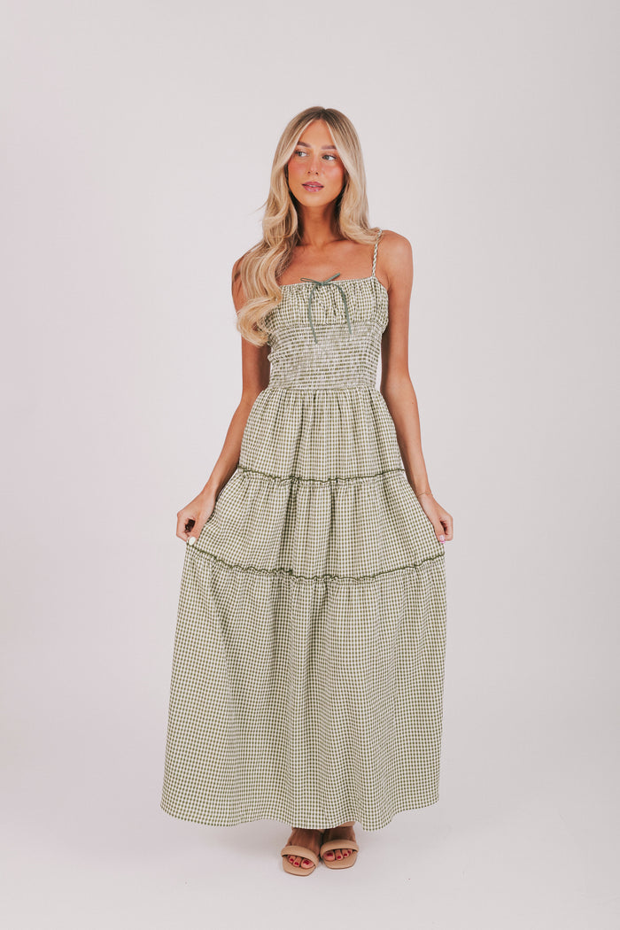 Olive and off white gingham maxi length dress with tied bow and shirred waist