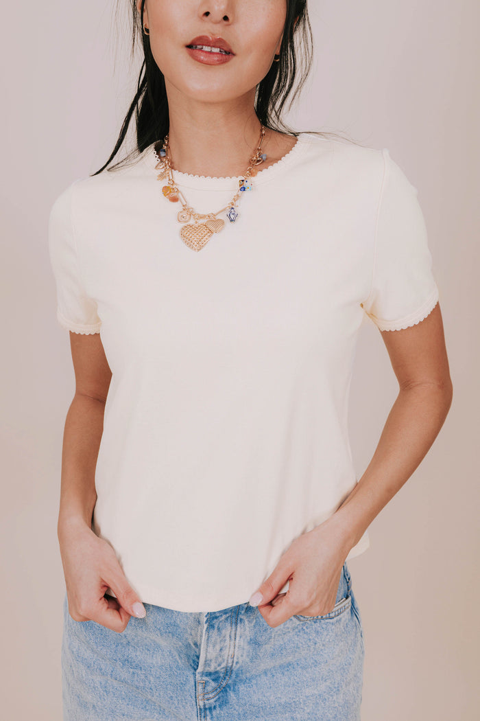 yellow scallop trim crew neck tee detail