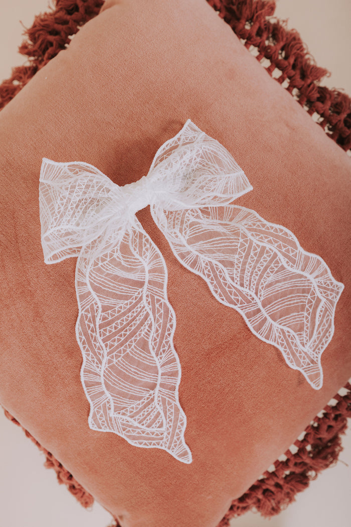 white mesh textured bow flatlay 2