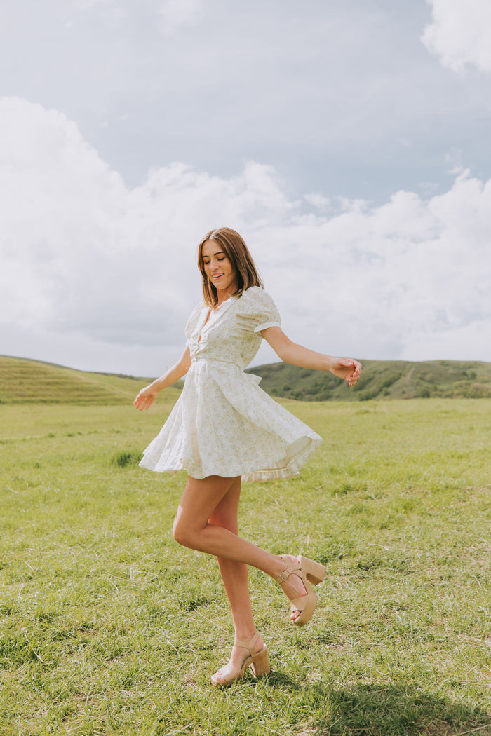 light floral mini dress with collar and puff sleeves lifestyle