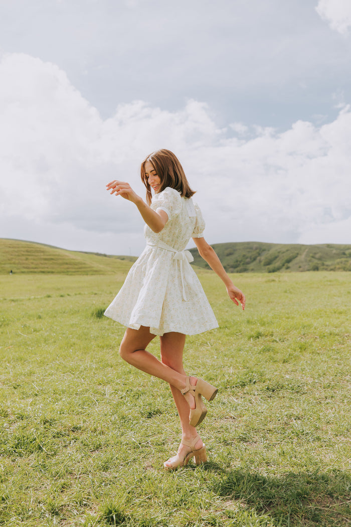light floral mini dress with collar and puff sleeves lifestyle