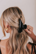 black claw clip with white polka dots