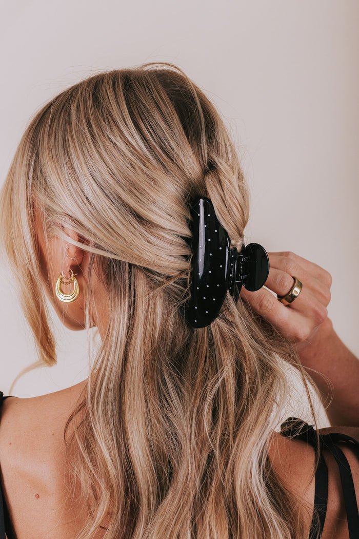 black claw clip with white polka dots