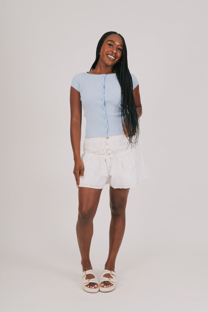 white eyelet shorts with buttons and tie
