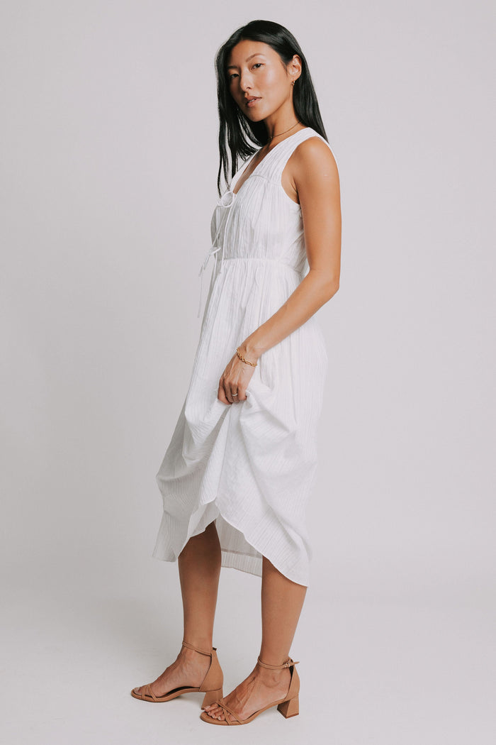 white sleeveless midi dress with bows on bodice side