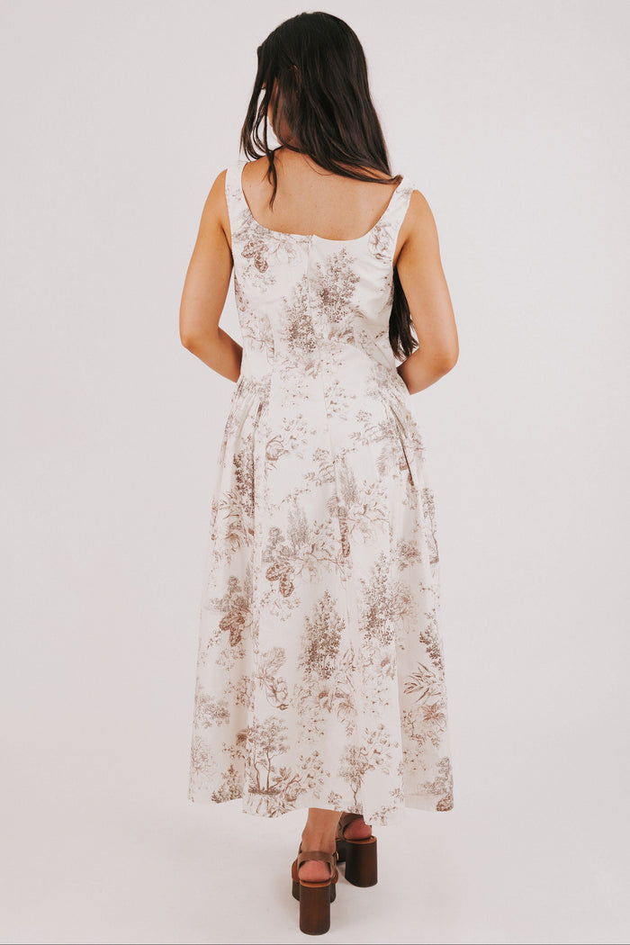 white sleeveless basque waist dress with brown floral print back