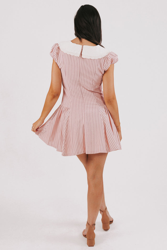 pink striped mini dress with white collar and puff sleeves back