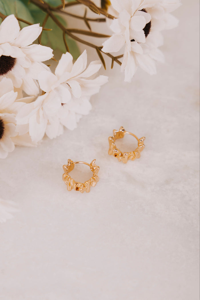abstract gold circle hoop flatlay