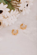 abstract gold circle hoop flatlay