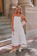 Cream midi/maxi dress with black polka dots. Tiers, pockets, lined, spaghetti straps