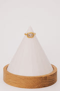gold ring with stone in the center