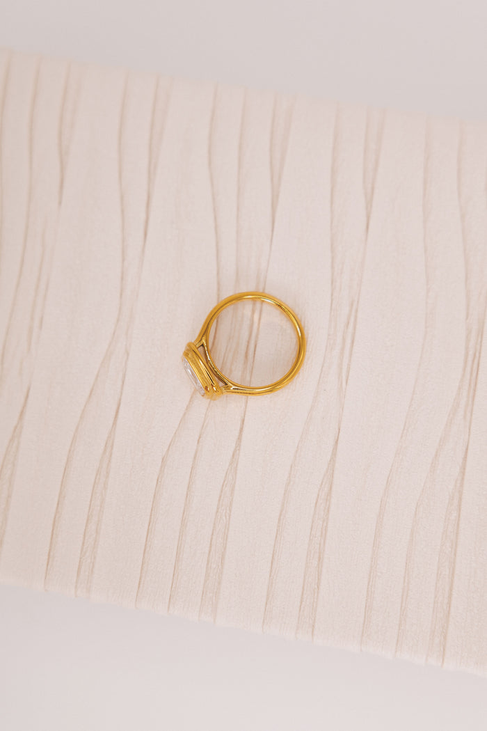 gold ring with stone in the center